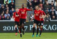 SWANSEA, WALES - NOVEMBER 06: Paul Pogba of Manchester United celebrates scoring his sides first goal with Michael Carrick during the Premier League match between Swansea City and Manchester United at Liberty Stadium on November 6, 2016 in Swansea, Wales.  (Photo by Michael Steele/Getty Images)